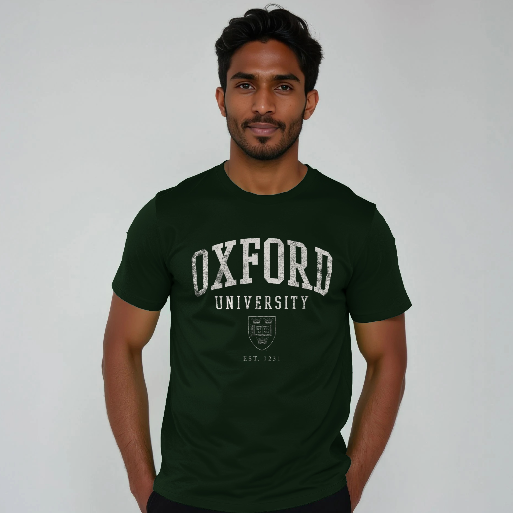Man wearing a green 'Oxford University' t-shirt against a gray background