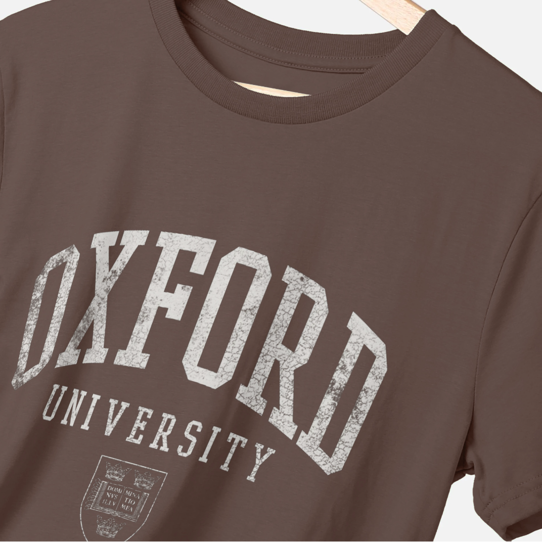Brown t-shirt with 'Oxford University' print on a hanger
